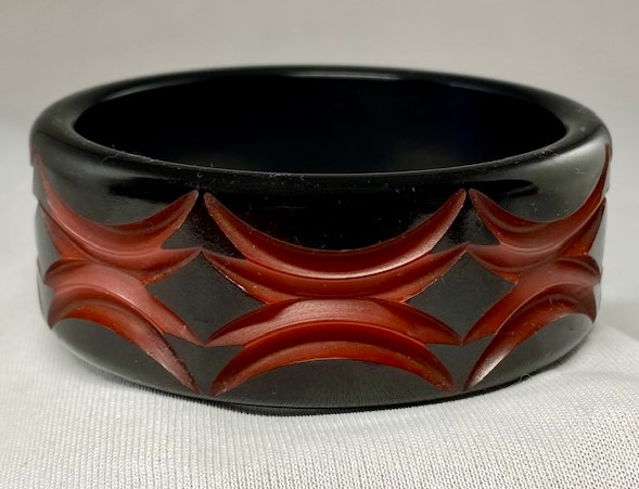 BB283 red geometric carved and overdyed bakelite bangle
